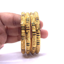 Designer Yellow Gold Plated metal Bangles with Engraved Texture and Geometric Motifs for a Traditional Look