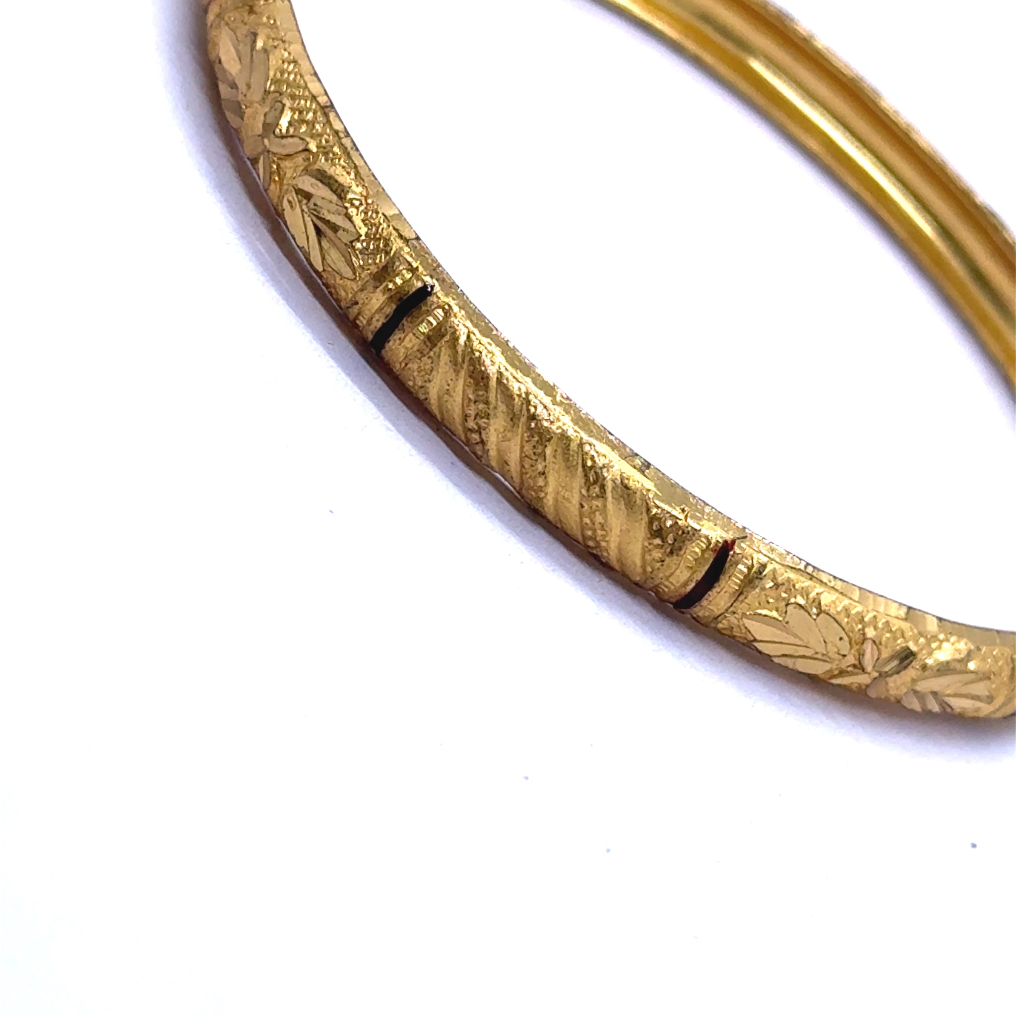 Set of Yellow Gold Plated metal Bangles with Artistic Engraved Segments and Classic Geometric Patterns