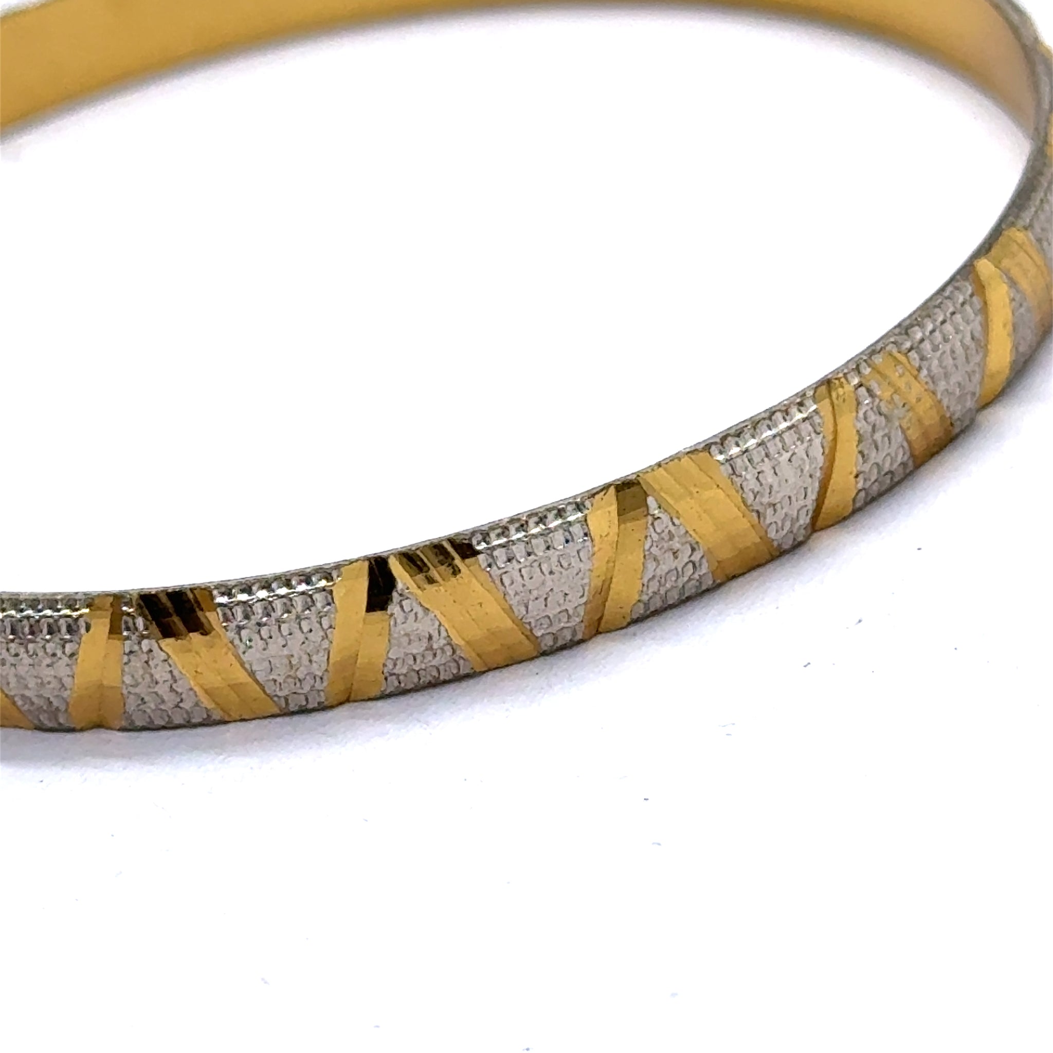 Traditional White Yellow Gold Plated metal Bangles with Engraved Segments and Intricate Geometric Motifs