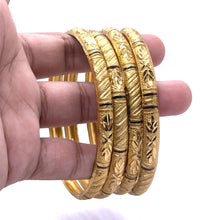 Set of Yellow Gold Plated metal Bangles with Artistic Engraved Segments and Classic Geometric Patterns