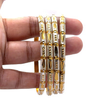 White Yellow Gold Plated metal Bangles Showcasing Traditional Design with Engraved Geometric Elements
