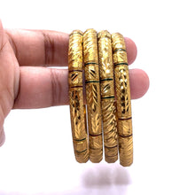 Traditional Yellow Gold Plated metal Bangles with Intricate Engraving and Symmetrical Geometric Textures